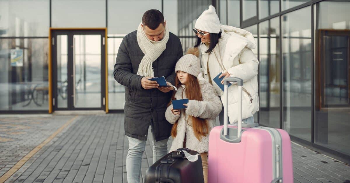 Family with passports at airport
